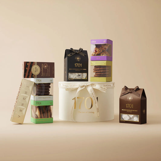 "Cocoa Lovers Gift Box" is a luxury hat box, and has an assortment of chocolate treats, including handcrafted nougat, confectionery, and imported chocolates placed around it. The gift box is perfect for chocolate lovers, whether shared with a special someone or enjoyed alone.