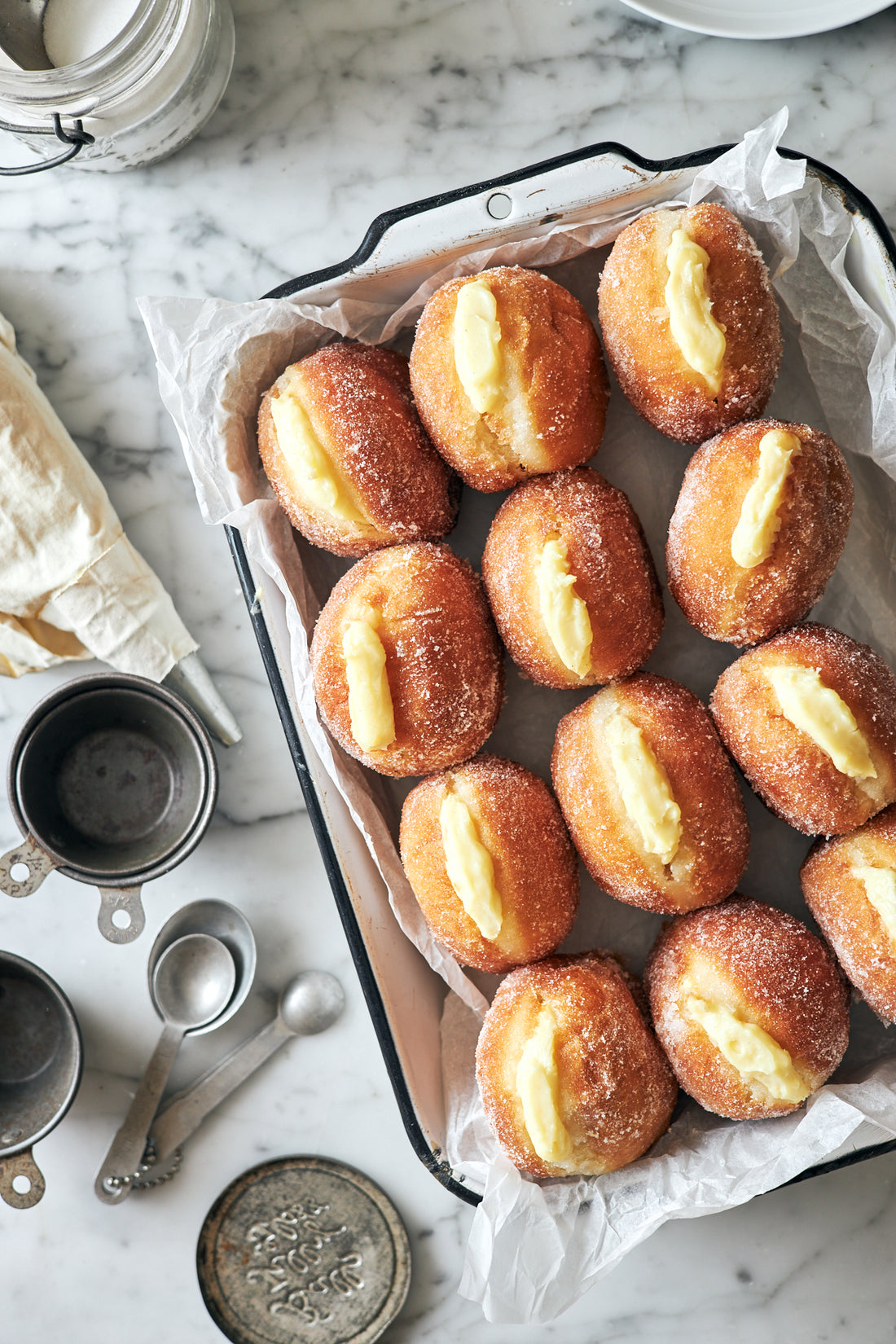 A Delicate Dance of Flavors: Lianne Scher’s Buttermilk Beignets Bursting with Creamy Custard