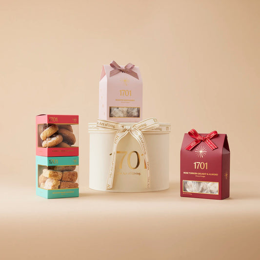 The Classic Gift Box features a hand-picked selection of our most popular products, including two boxes of our handcrafted honey nougat and two boxes of our delectable biscuits. Whether you're treating yourself or gifting to a loved one, this box is sure to impress.