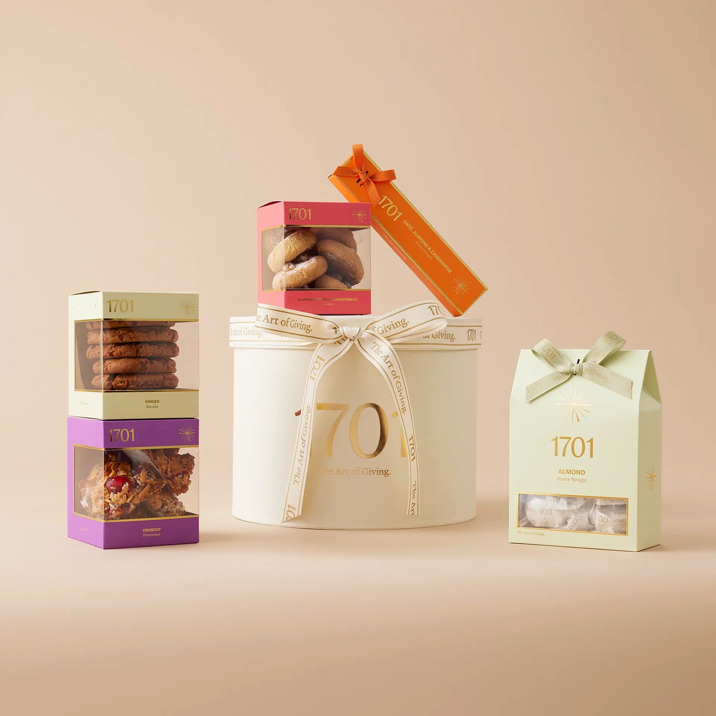 "Provence" medium gift box features one boxes of handcrafted honey nougat and three boxes of delicious biscuits, perfect for sharing with loved ones or as a special treat for oneself. 